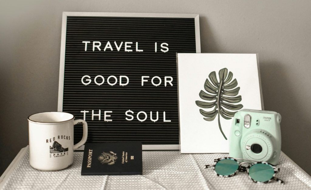 Sign saying "Travel is good for the soul". It's our collective travel experiences that help travel feed our soul. Photo by: Element5 Digital