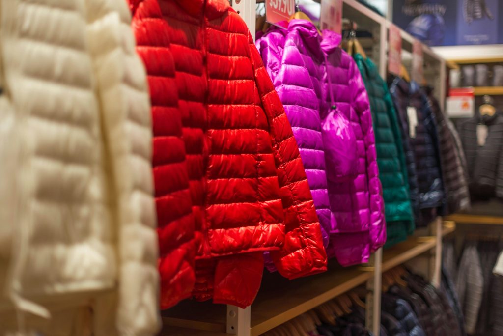 Photo of colorful down winter jackets, which are essential to dress for cold weather correctly. Photo by Roman Pohorecki